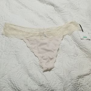Tan thing underware with cream lace around the top